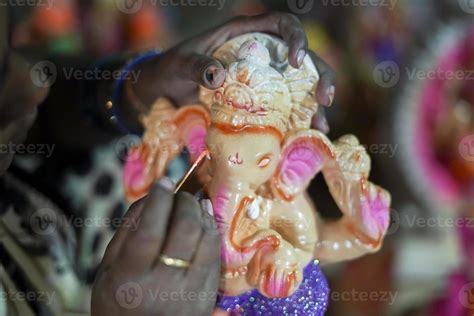 Artist making clay ganesh idol for ganesha festival - concpet of hindu ...