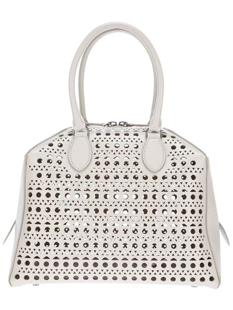 Alaïa Perforated Leather Bag in White (beige) | Lyst