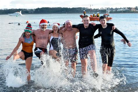 Boxing Day swim sees young and old plunge into the icy sea for charity ...