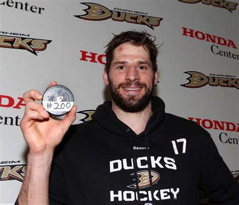 Ryan Kesler #17 of the Anaheim Ducks poses for a photo with a puck to ...