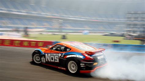 Nissan Nismo 370Z Drifting, orange black teal and red nos decal racecar, HD wallpaper ...