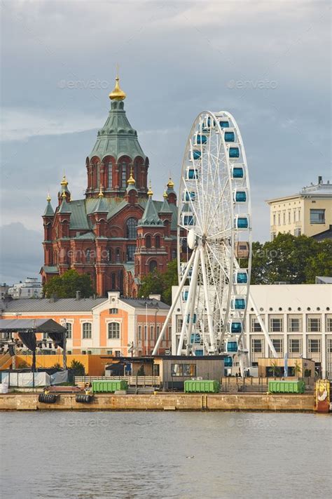 Helsinki skyline with harbor, wheel and Uspenki cathedral. Travel ...