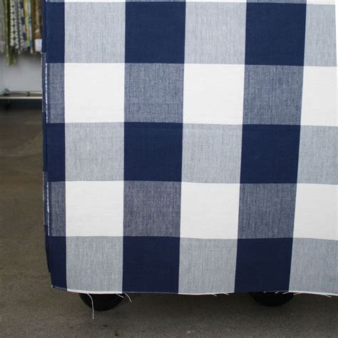 A classic, navy blue buffalo check fabric with a warm, natural cream.Perfect for drapery, roman ...