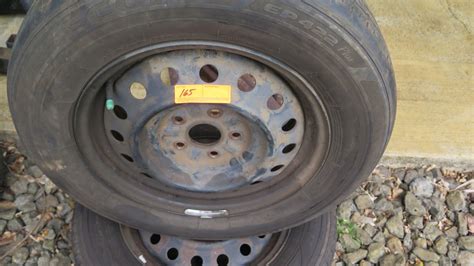 2-5x4.25x16 stock steel rims with 215/65R16 tires approx. 60% tread ...