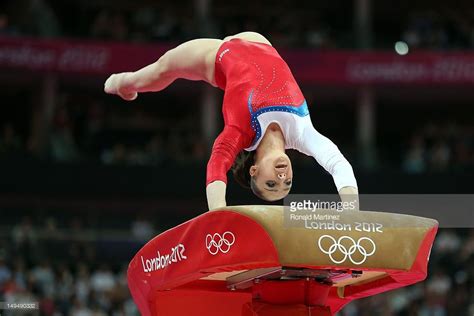 Aliya Mustafina of Russia competes on the vault in the Artistic... | Gymnastics pictures, Sport ...