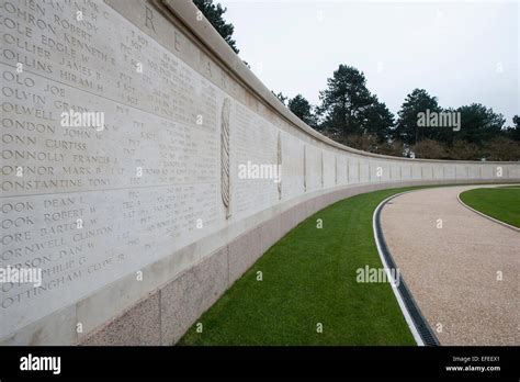 Names of fallen WWII soldiers carved in a long wall at the American cemetery, Normandy Stock ...