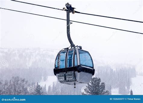 Ski Lift on Cable Car with a Closed Cabin with Blue Mirrored Glass on the Background Stock Image ...