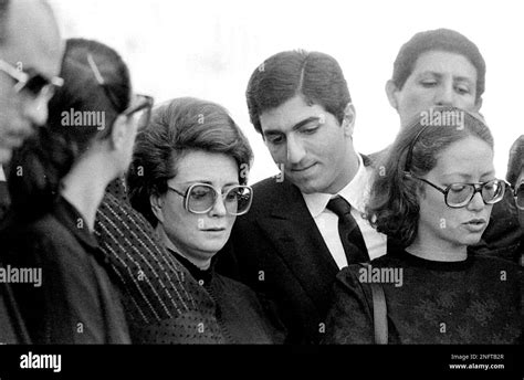 Jehan Sadat, widow of assassinated Egyptian President Anwar Sadat stands with Reza Pahlevi, son ...