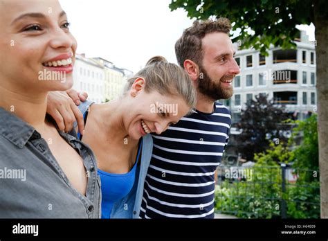 Three happy friends outdoors Stock Photo - Alamy