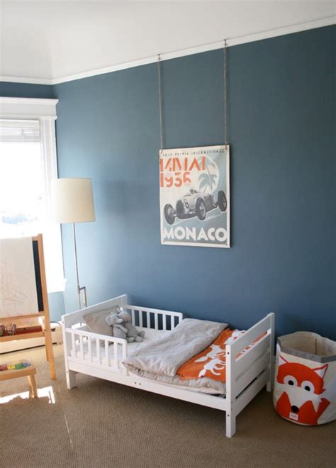 Kids Room. Dark Blue Wall Paint With Artwork Decor Feat Modern White Wooden Boys Toddler Bed ...