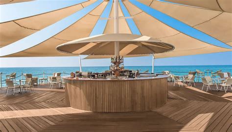 Pin by 최재국 on Пляжная зона | Beach lounge, Pool bar design, Beach cafe