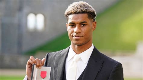 Marcus Rashford receives MBE from Prince William for school meal ...