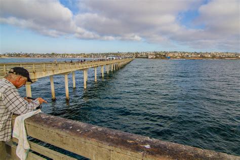 Old man fishing at the OB pier : r/sandiego