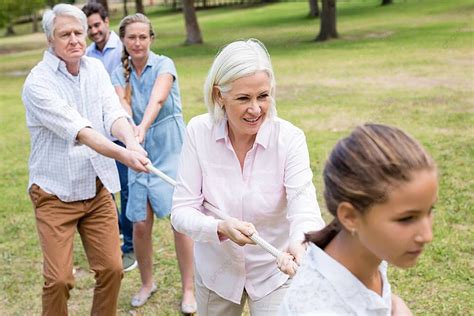 A Tug Of War Game Being Played By A Multigenerational Family Photo Background And Picture For ...