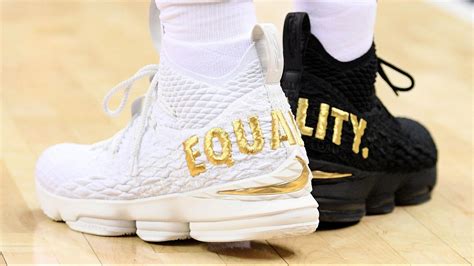 LeBron James wears 1 black shoe, 1 white shoe with 'equality' on the ...