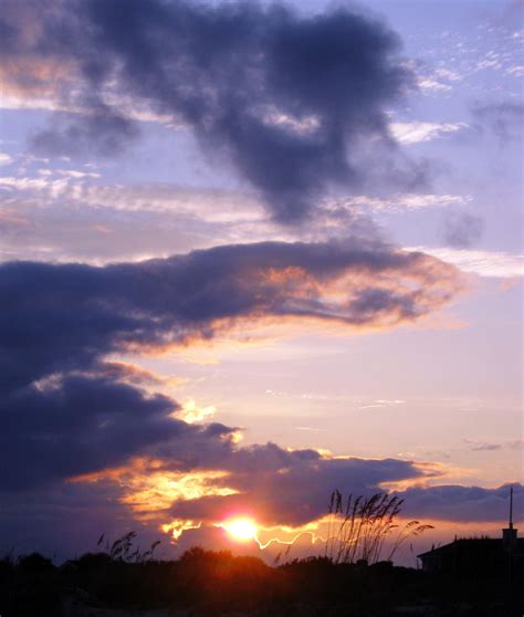 Sun setting behind the clouds, Isle of palms, SC by winterface on DeviantArt