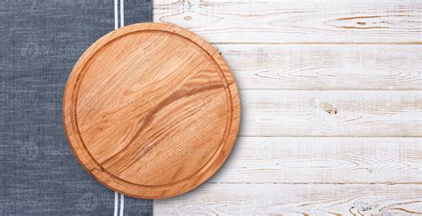 Pizza board with napkin on wooden table. Top view mockup 14378070 Stock ...