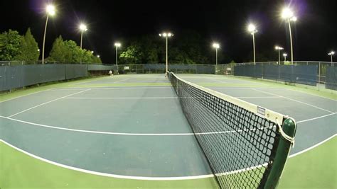 Playing Tennis On Some Beautiful Courts At Night Time. Stock Footage Video 2327741 - Shutterstock