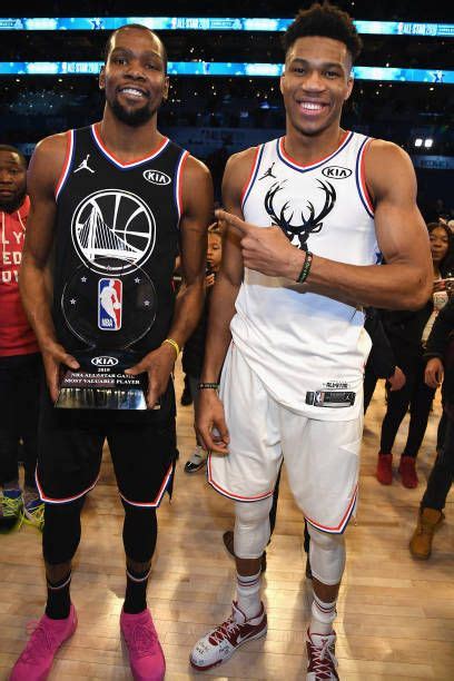 Kevin Durant and Giannis Antetokounmpo pose on the court after the... | Best nba players, Kevin ...