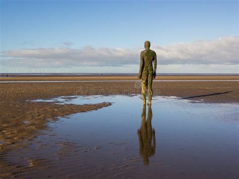 Statue on Crosby beach editorial stock image. Image of clouds - 85982034