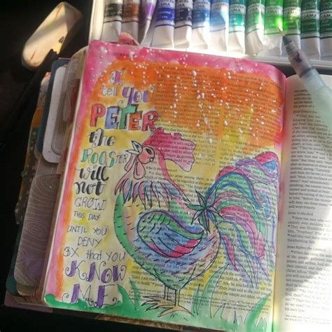 an open bible with watercolors and crayons