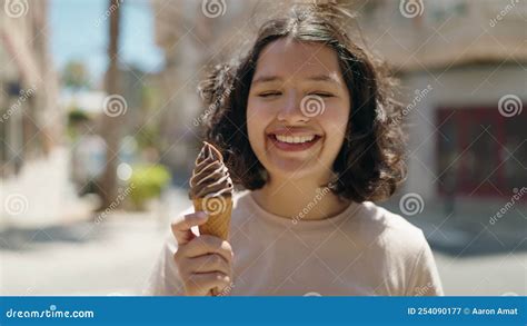 Young Woman Smiling Confident Eating Ice Cream at Street Stock Video ...