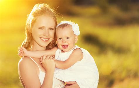 happy family on nature mother and baby daughter - The Center of Bliss, LLC