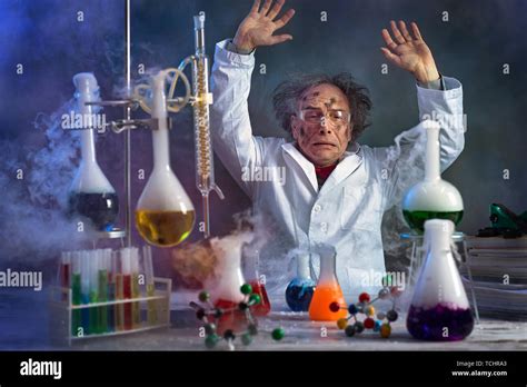 crazy scientist with dirty face in lab surrounded by the smoke from the explosion Stock Photo ...