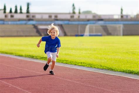 Child Running in Stadium. Kids Run. Healthy Sport Stock Photo - Image ...