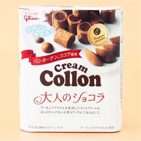 a box of cream colon with nuts on the side