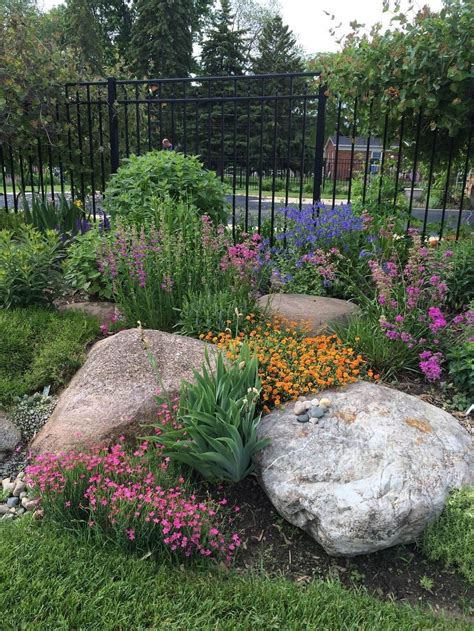 Working in rocks into your garden and beds is a beautiful way to add ...