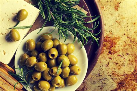 Free Photo | Fresh tasty greek green olives with cheese feta or goat cheese. closeup ...