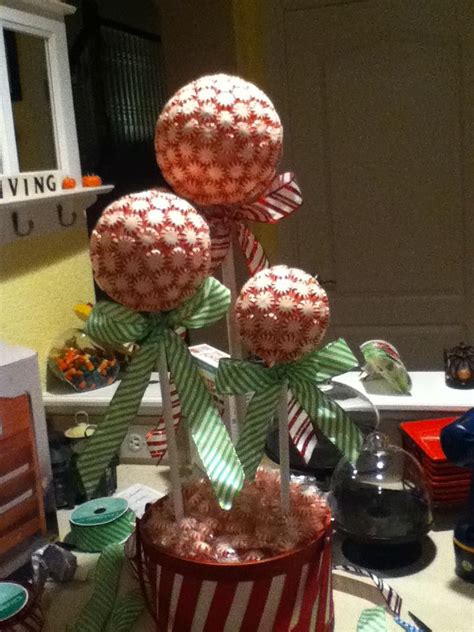 Glue peppermints on styrofoam ball. Glue rods in to foam on basket and tie bows!! Ta-Da ...