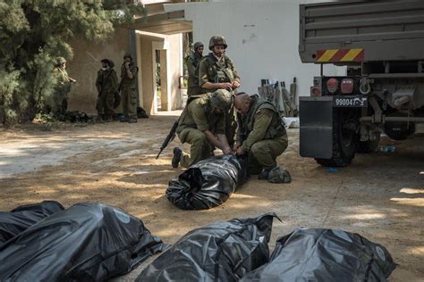 At Kfar Azza, an Israeli Kibbutz, ‘It’s Not a War or a Battlefield. It’s a Massacre.’ - The New ...