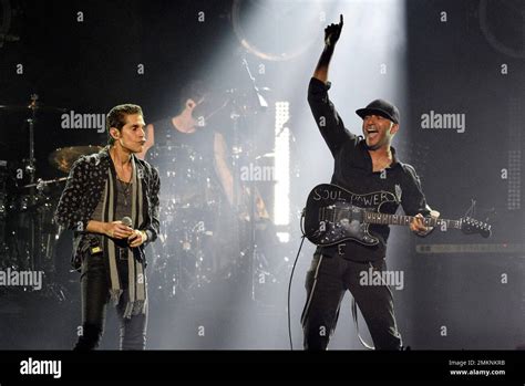 Singer Perry Farrell, left, performs with Audioslave guitarist Tom Morello during "I Am The ...