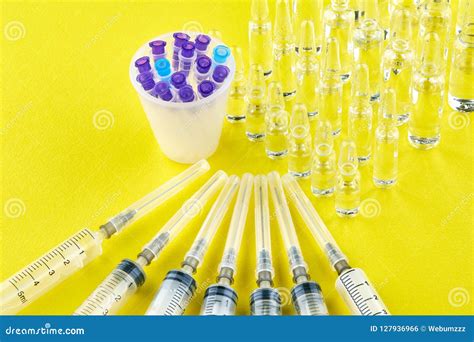 Syringes, Needles in Measuring Glass and Ampoules Stock Photo - Image of ampoule, phial: 127936966