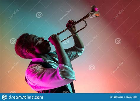 African American Jazz Musician Playing Trumpet. Stock Photo - Image of attractive, background ...