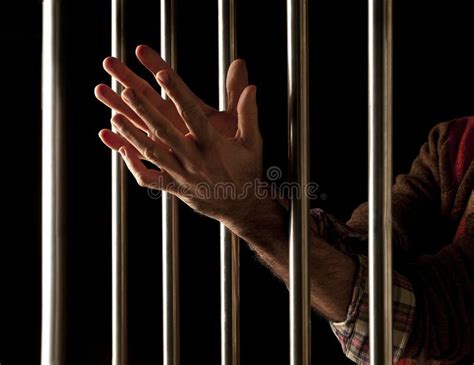 Prisoner behind bars stock photo. Image of captivity - 28252300