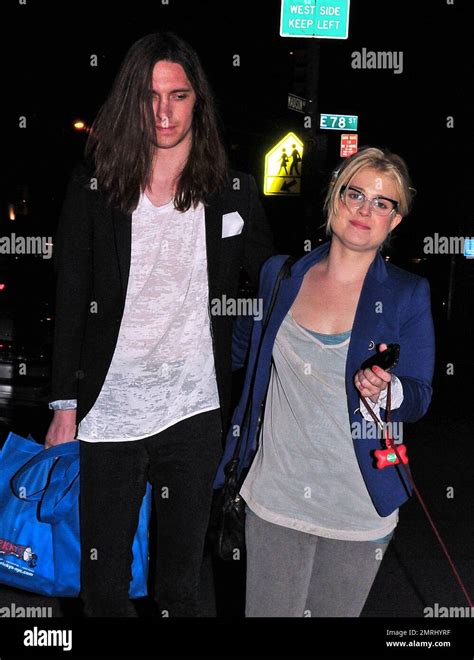 Wearing little no makeup and glasses, Kelly Osbourne looks less put together than usual as she ...