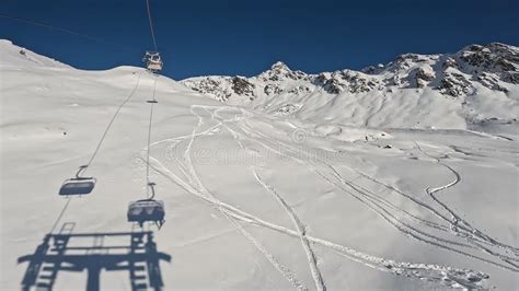 Passo Del Tonale, Italy. Chairlift with Skiers is Moving To the Top of ...