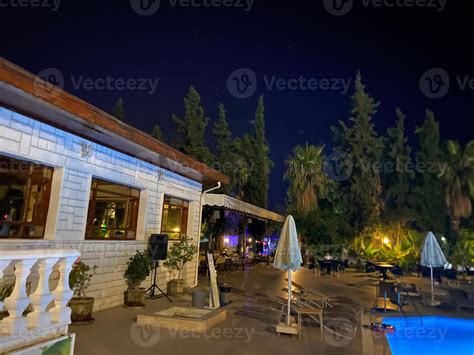 Luxury Hotel With Swimming Pool At Night 15045254 Stock Photo at Vecteezy