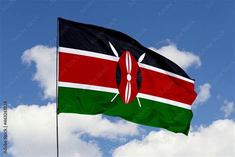 Kenya flag isolated on the blue sky background. close up waving flag of ...