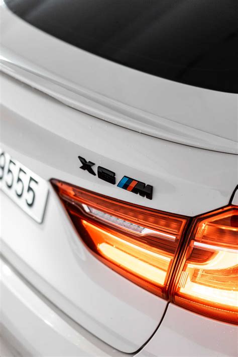 Black BMW X6M Rear Badge Logo | Free Car Photo by picjumbo