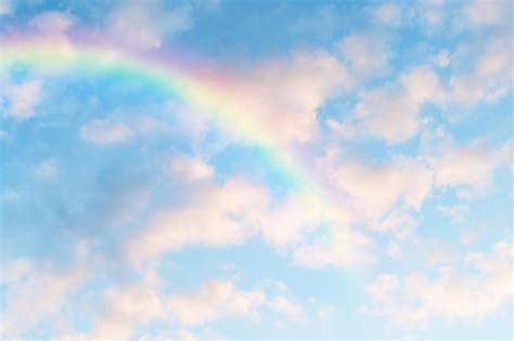 Premium Photo | Blue sky with clouds and rainbow