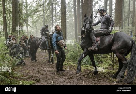 DAWN OF THE PLANET OF THE APES, Jason Clarke (center), Andy Serkis ...