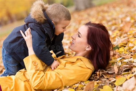 Happy Family Hug in the Autumn Leaves Stock Photo - Image of love ...