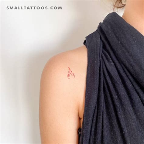 Red fire flame temporary tattoo located on the