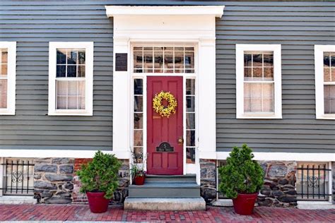 The oldest house in the South End of Boston has a raspberry pink door against a slate blue ...