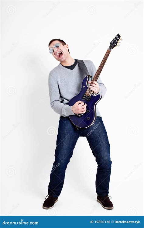 Rockstar Playing On Guitar. Royalty Free Stock Image - Image: 19320176