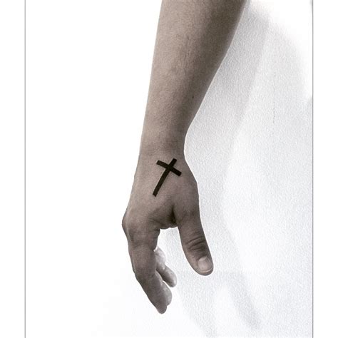 Solid cross tattoo on the hand - Tattoogrid.net